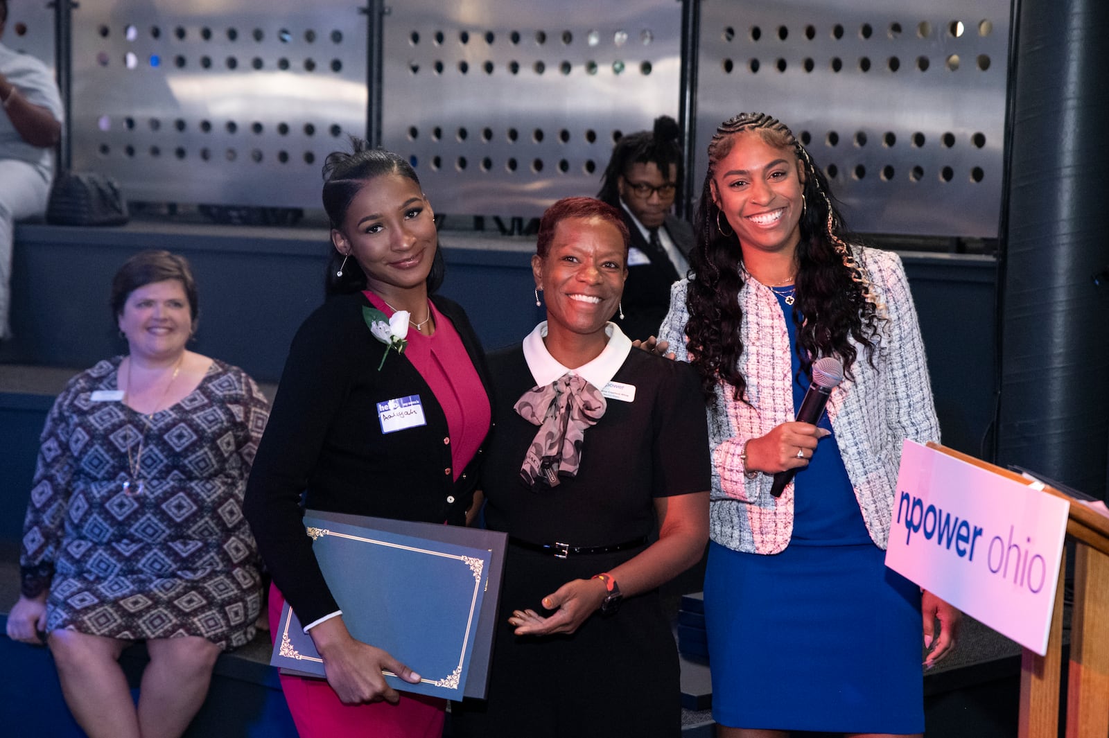 Demarus Crawford-White, (center) executive director of NPower in Dayton with 2024 graduates Aaliyah Sumlin (left) and Allison Williams (Right)