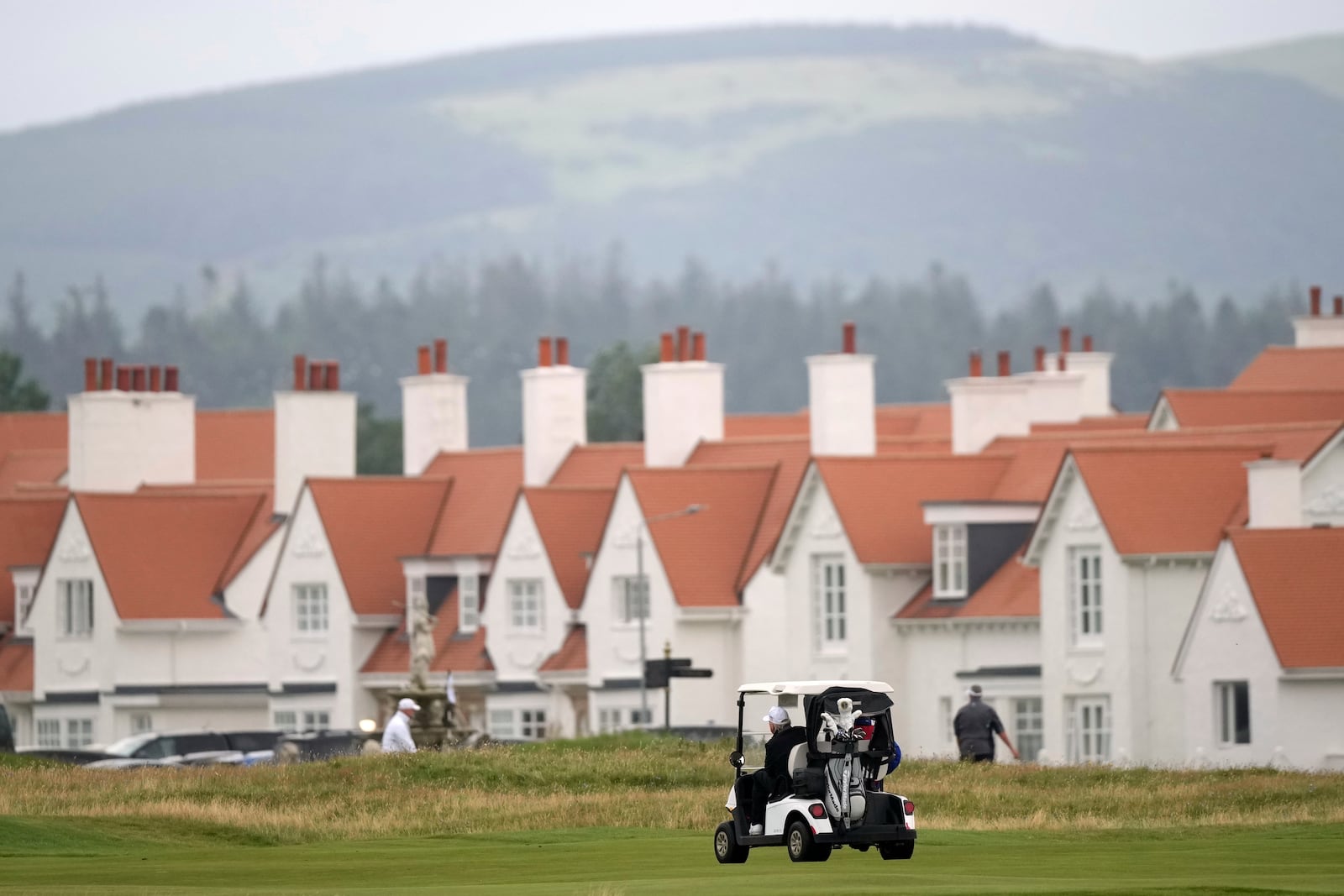 President Donald Trump steers a golf cart at the Trump Turnberry golf course in Turnberry, Scotland, Sunday, July 27, 2025.(AP Photo/Alastair Grant)
