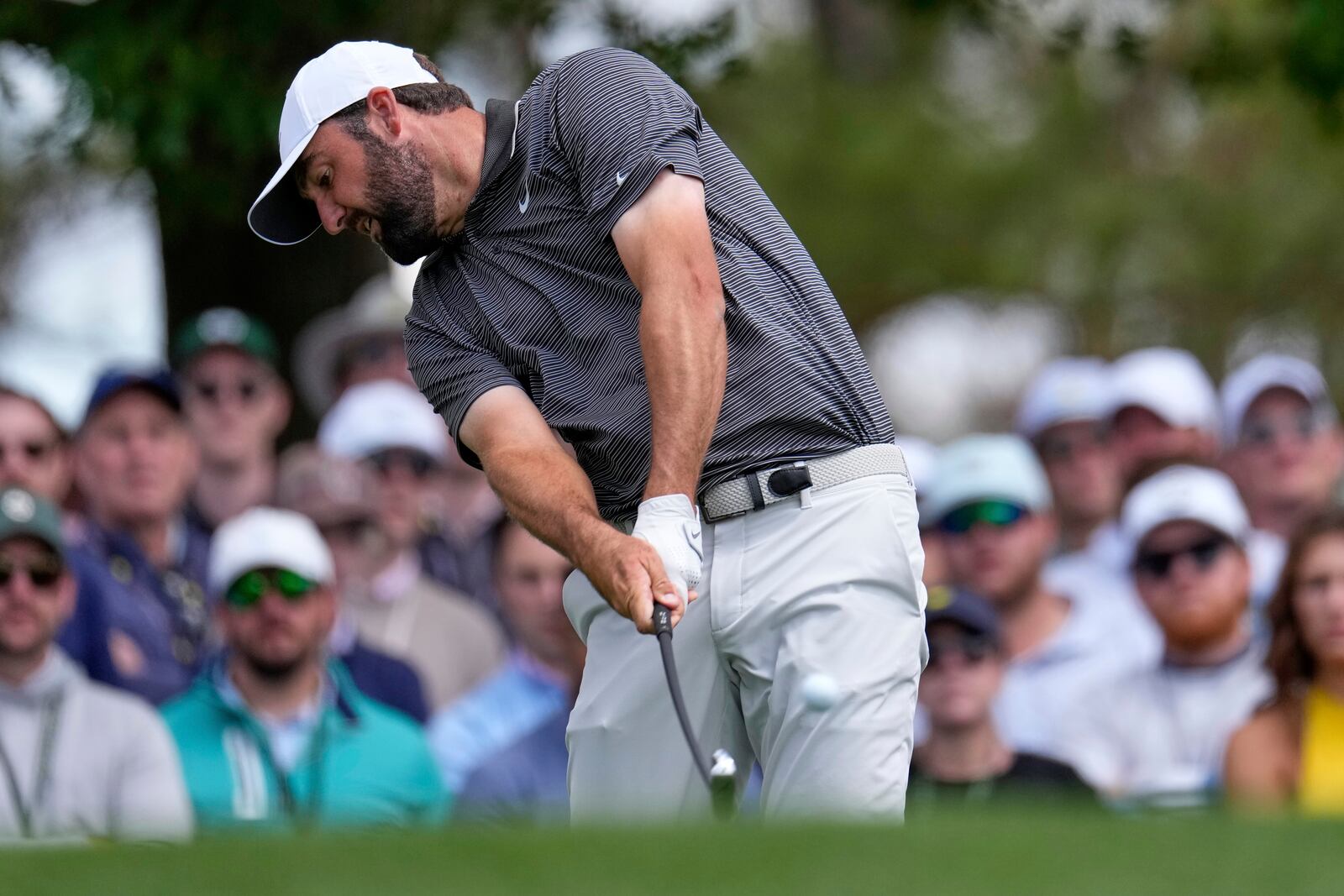 Scottie Scheffler hits his tee shot on the fourth hole during the third round at the Masters golf tournament, Saturday, April 12, 2025, in Augusta, Ga. (AP Photo/George Walker IV)