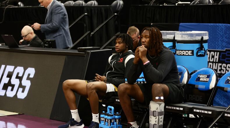 Dayton's Malachi Smith and Jaiun Simon watch the team practice for the NCAA tournament at the Delta Center in Salt Lake City, Utah, on Wednesday, March 20, 2024. David Jablonski/Staff