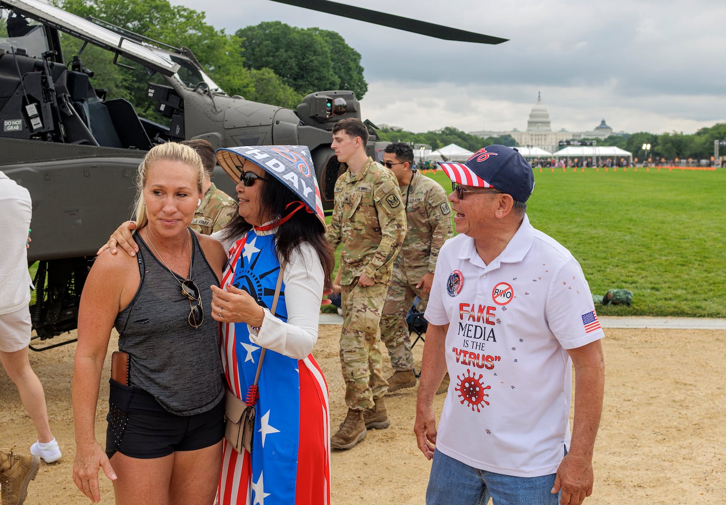 Rep. Marjorie Taylor Greene (R-Ga.) greets attendees on the National Mall ahead of a parade commemorating the Army's 250th anniversary in Washington on Saturday, June 14, 2025. (Jason Andrew/The New York Times) 