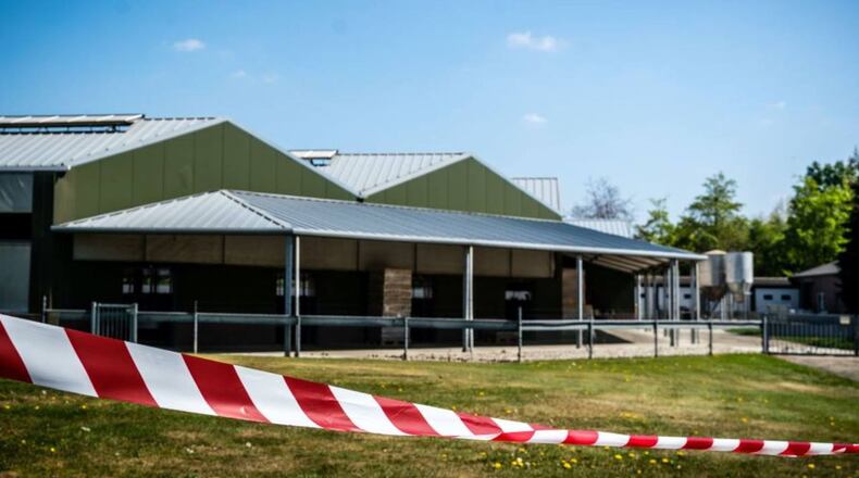 Barrier tape cordons off buildings of a mink farm at Beek en Donk, in the eastern after tests showed that animals within the buildings had been infected with coronavirus.