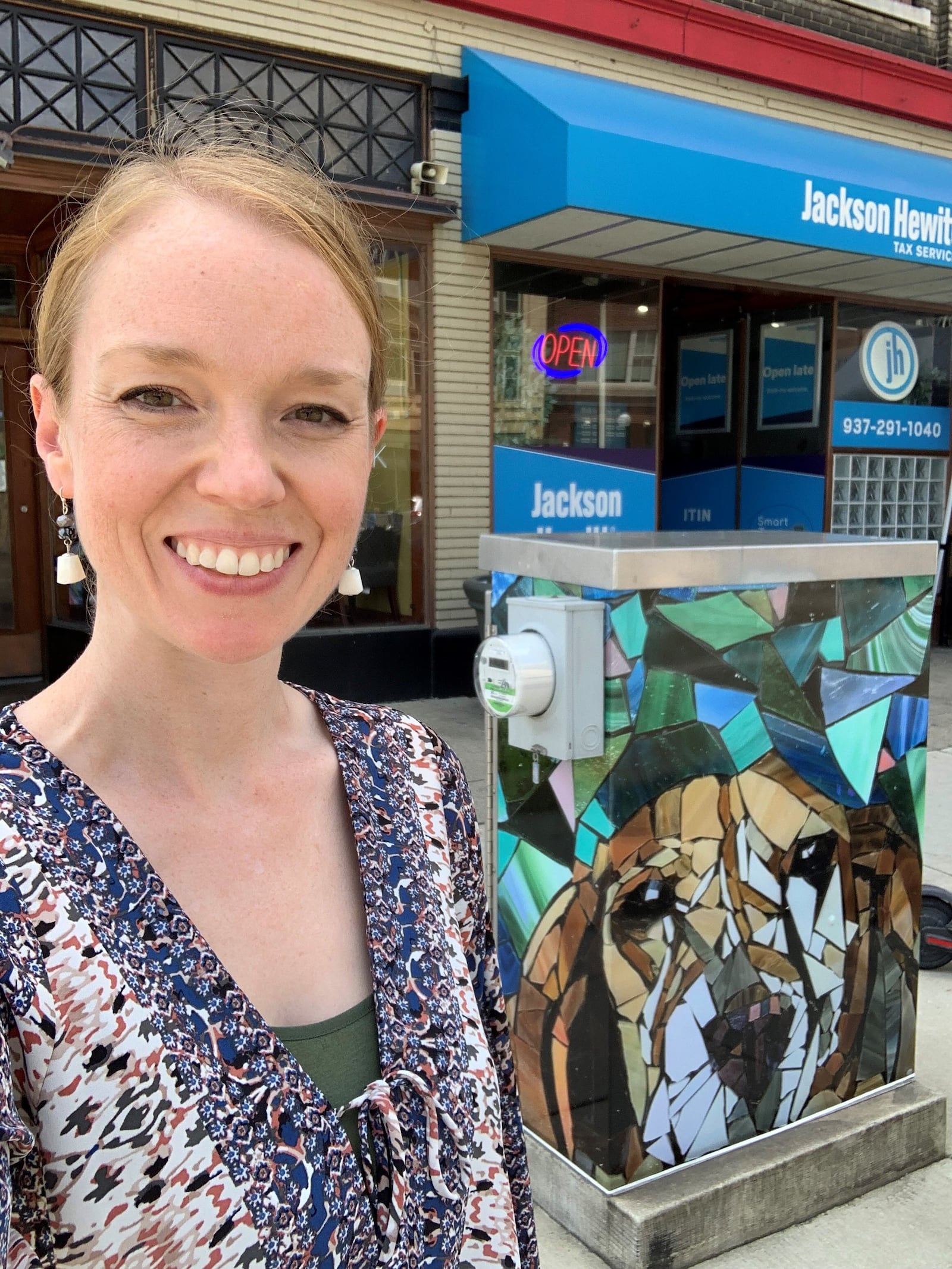 Amanda Darrah in front of her ArtWraps work, "Truffles." CONTRIBUTED