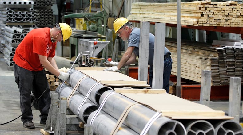 Magnode Corp. workers band extruded aluminum at their Trenton plant in this 2012 photo. FILE.