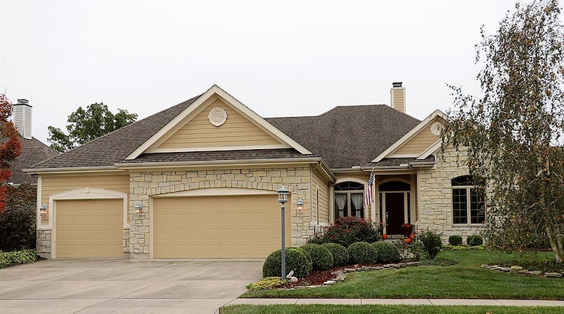 This split floor plan ranch has 10-foot ceilings and walls of windows with park-like views. The home has about 4,200 sq. ft. of living space and a finished lower level accessible by stairs or elevator. CONTRIBUTED PHOTO BY KATHY TYLER