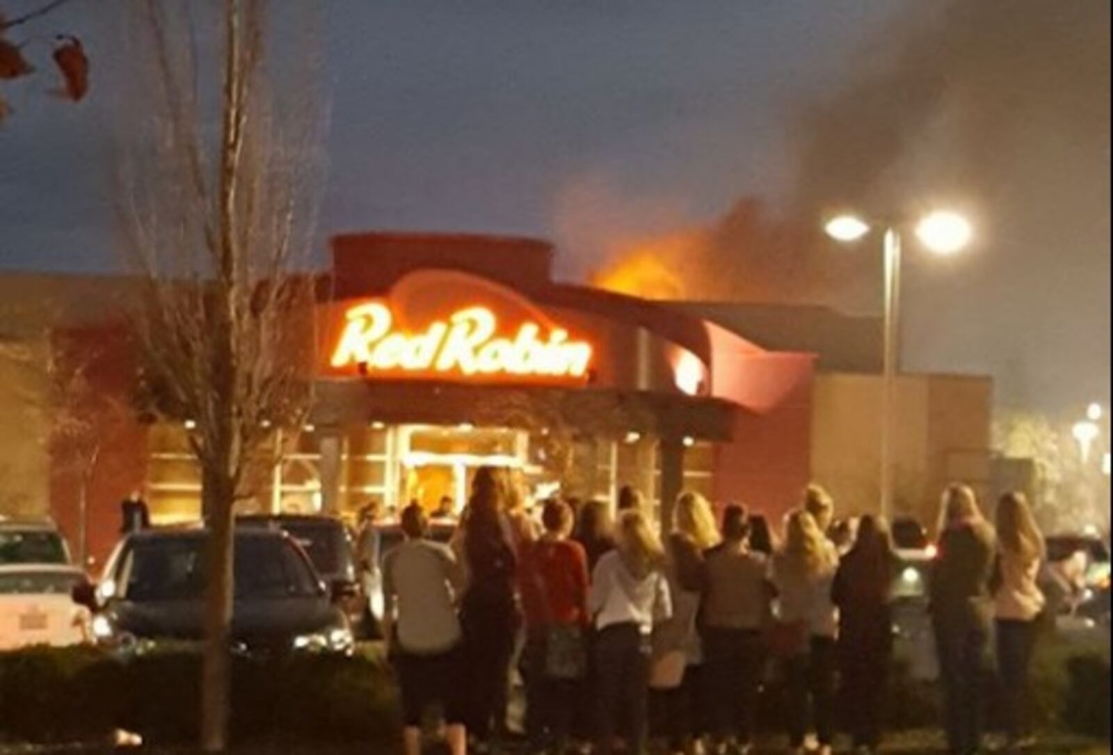Red Robin was evacuated Friday evening, Nov. 11, 2016, after a fire in the hood system for the grills extended to the roof of the popular restaurant at the Mall of Fairfield Commons in Beavercreek. (Kelsey Jo Shurina/Contributed)