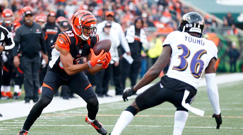 CINCINNATI, OH - JANUARY 1: Tyler Boyd #83 of the Cincinnati Bengals catches a pass while being defended by Tavon Young #36 of the Baltimore Ravens during the second quarter at Paul Brown Stadium on January 1, 2017 in Cincinnati, Ohio. (Photo by Michael Hickey/Getty Images)