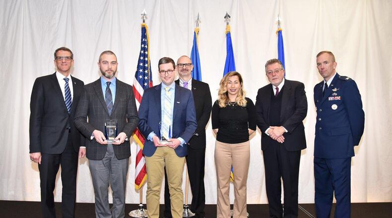 The Materials and Manufacturing Directorate’s most prestigious award at the 67th annual awards luncheon is the Charles J. Cleary Scientific Award. The winner is the Metallic Materials and Processes Research Team. Shown left to right are Timothy Sakulich, Materials and Manufacturing Directorate director, and team members Dr. Edwin Schwalbach and Dr. Sean Donegan, along with Dr. Tim Bunning, Materials and Manufacturing Directorate chief scientist, Cara Cleary, Michael Cleary and Col. Michael Warner, Materials and Manufacturing Directorate deputy director. (U.S. Air Force photos/Spencer Deer)