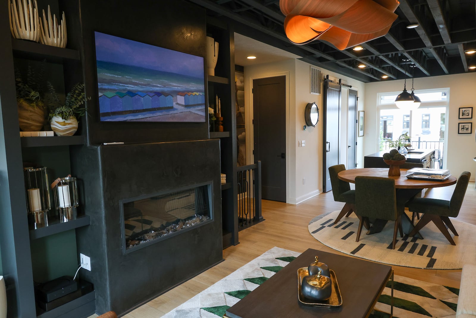 The living room and dining room in a townhome at The Townes at Wright-Dunbar. BRYANT BILLING / STAFF