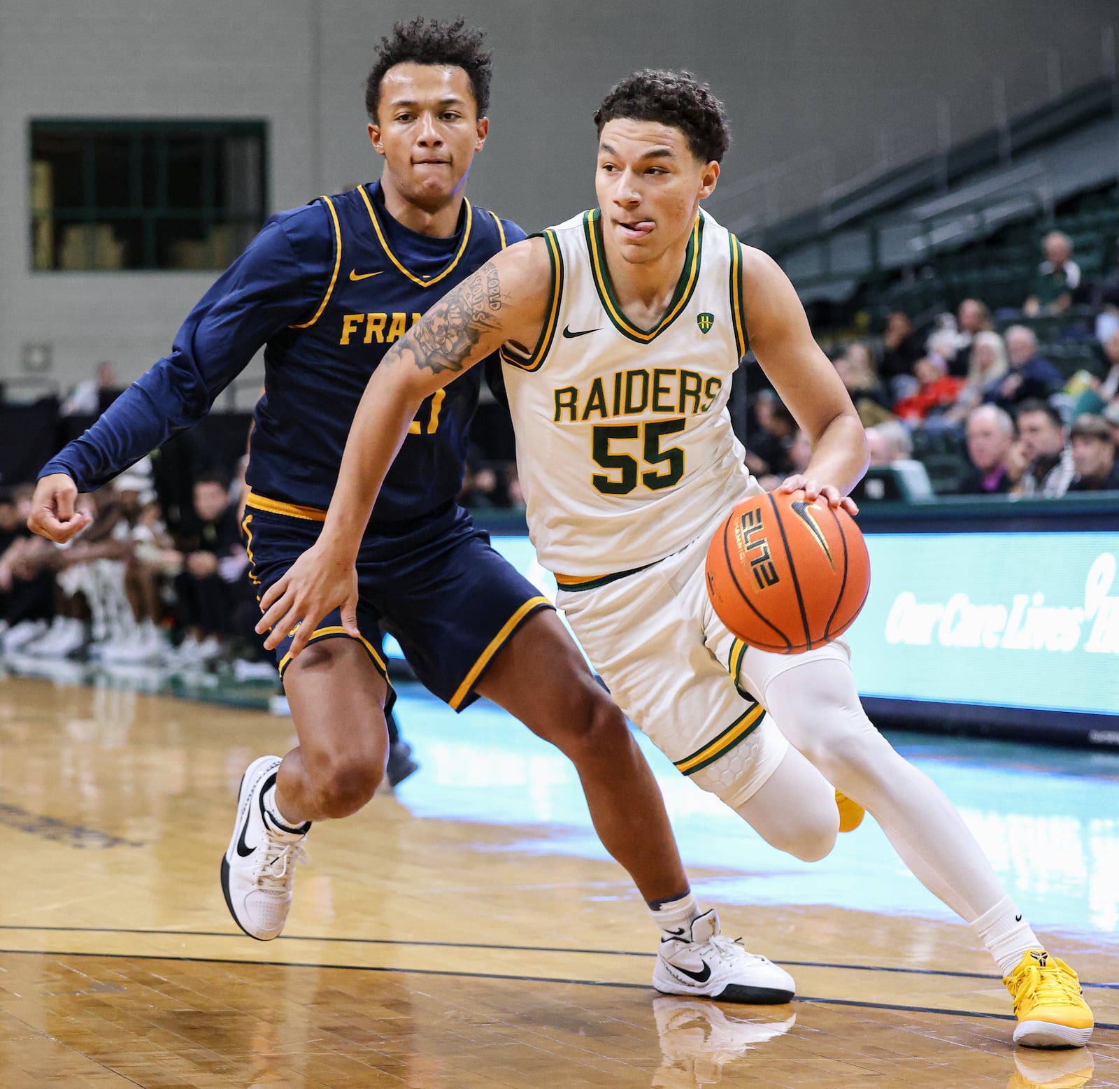 Wright State freshman guard Michael Cooper dribbles ahead of Franklin College's Logan Woods during a season opener against Franklin College on Monday, Nov. 3 at Ervin J. Nutter Center. BRYANT BILLING/STAFF