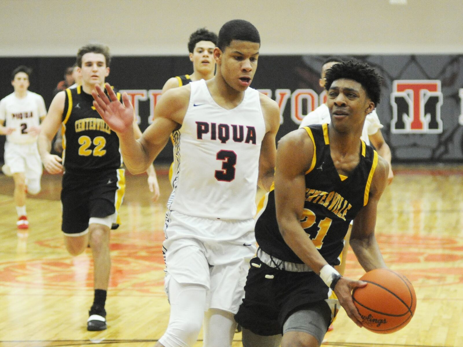 Kaleb Mitchell of Centerville (right) beats Trey Richmond of Piqua to the hoop. Centerville defeated Piqua 64-29 in a boys D-I sectional opener at Trotwood-Madison on Friday, Feb. 22, 2019. MARC PENDLETON / STAFF