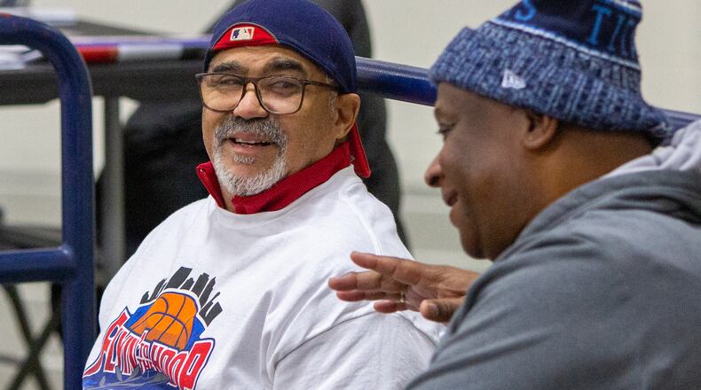 Dino Ross, left, talks with a friend Sunday at Flyin' To The Hoop at Trent Arena in Kettering. Ross has attended every event since it began in 2003 and didn't let getting hit by a car Friday while walking to the arena stop him. Jeff Gilbert/CONTRIBUTED