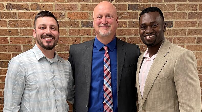 Tom Thompson with his sons, Brooks Thompson (left) and Romain Sato (right). CONTRIBUTED