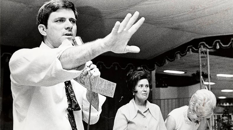 Phil Donahue at a charity auction with Erma Bombeck. Donahue and Bombeck were neighbors in Centerville. DAYTON DAILY NEWS ARCHIVE