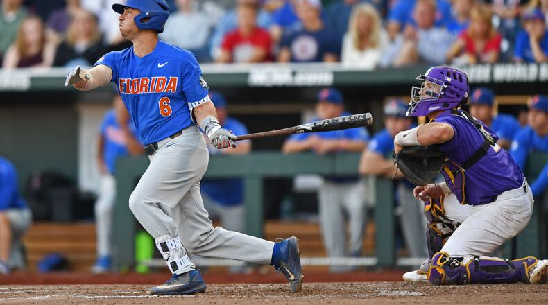 OMAHA, NE - JUNE 26:  Third basemen Jonathan India #6 of the Florida Gators hits a two run double against the LSU Tigers in the third inning during game one of the College World Series Championship Series on June 26, 2017 at TD Ameritrade Park in Omaha, Nebraska.  (Photo by Peter Aiken/Getty Images)