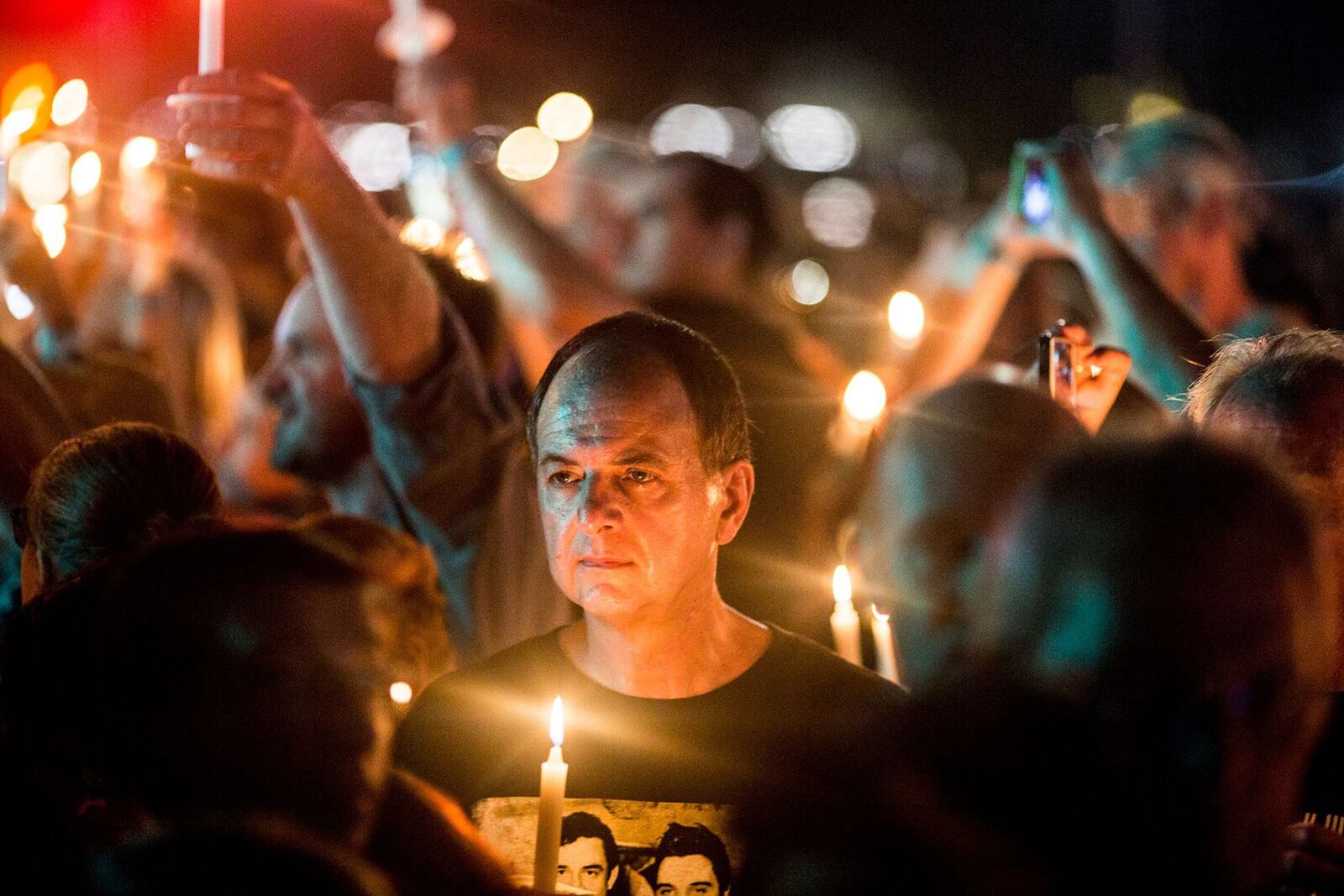 Elvis Presley fans were at Graceland in Memphis to pay homage at the candlelight vigil during "Elvis Week" that marks the 40th anniversary of Presley's Aug. 16, 1977, death.