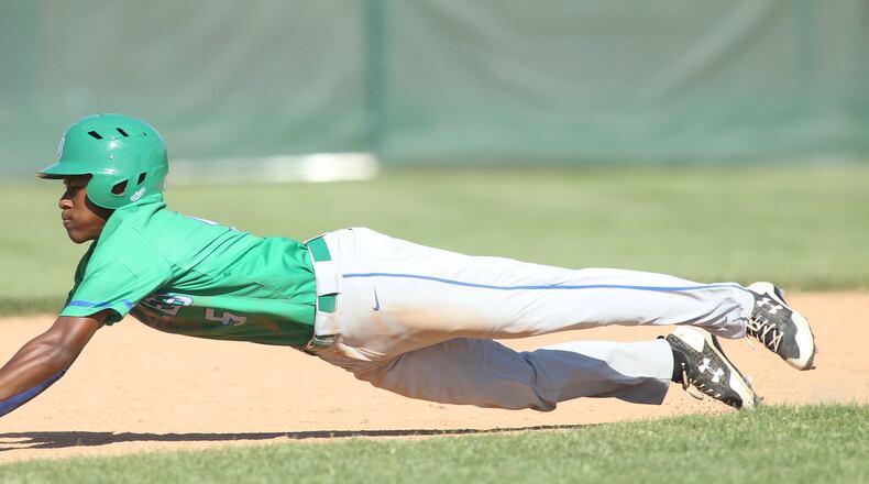 Chaminade Julienne’s A.J. Solomon slides into second base against Cincinnati Hills Christian Academy in a Division II regional final on Friday, May 25, 2018, at Mason High School. David Jablonski/Staff