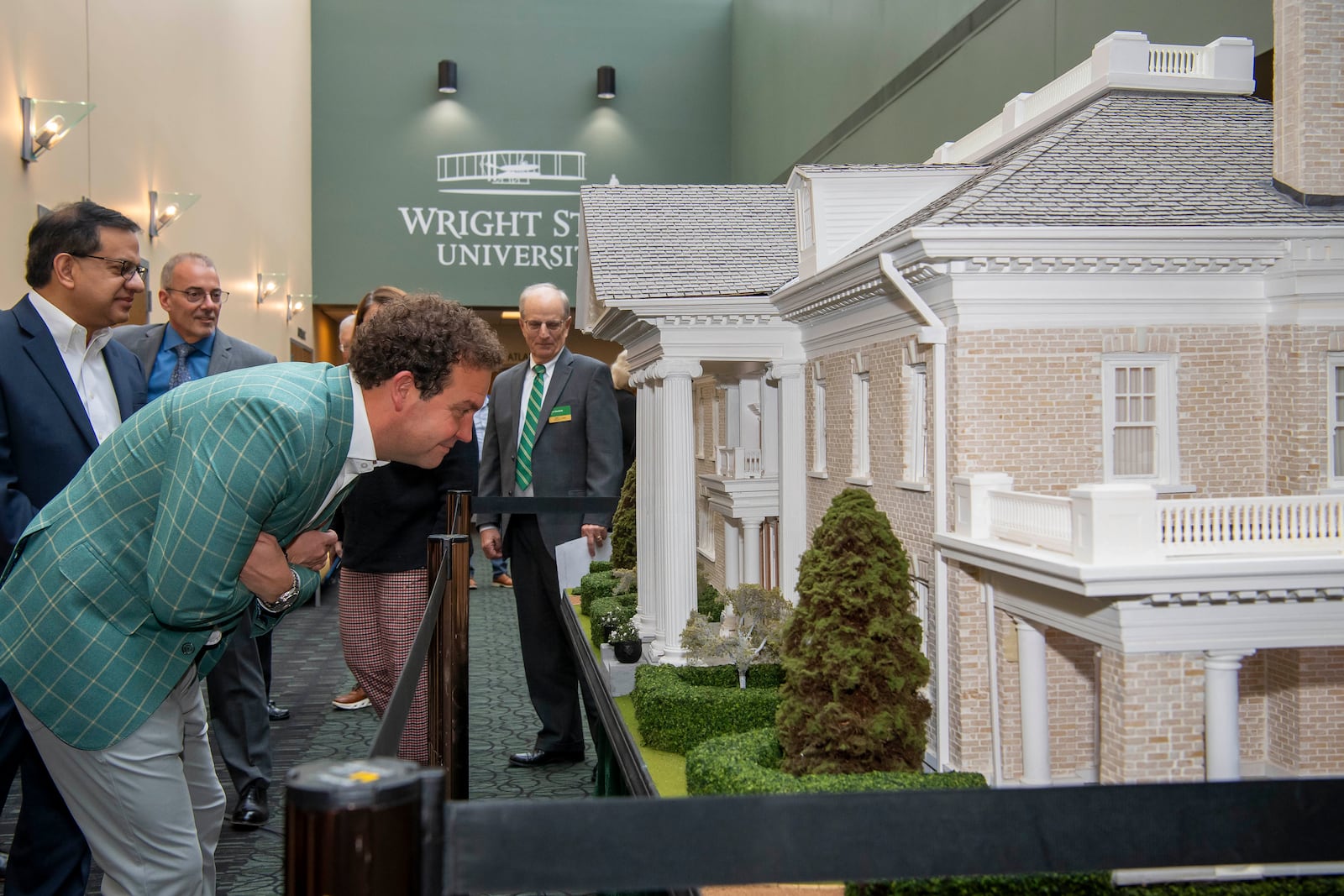 Andy Platt takes an up-close look at the replica of Hawthorn Hill, the Wright brothers’ home. The replica was donated to Wright State University. Contributed by Wright State University