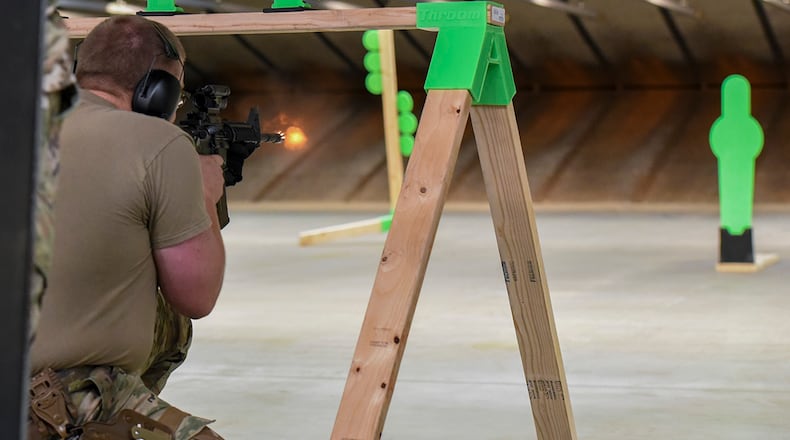 Staff Sgt. Clayton Nyp, 88th Security Forces Squadron installation entry controller, fires an M4 carbine July 22 at Wright-Patterson Air Force Base’s indoor firing range. U.S. AIR FORCE PHOTO/MATTHEW CLOUSE