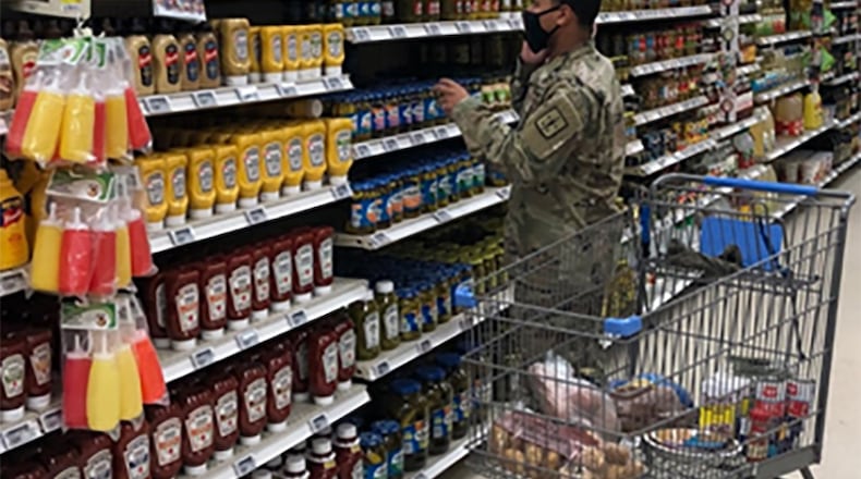 A soldier shops in a commissary. Family Fit Lifestyle Month in January highlights nutrition and the benefits of exercising. DEFENSE COMMISSARY AGENCY PHOTO/KEVIN ROBINSON