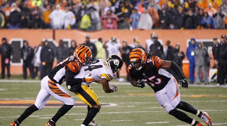 CINCINNATI, OH - JANUARY 9: Vontaze Burfict #55 of the Cincinnati Bengals makes a late hit on Antonio Brown #84 of the Pittsburgh Steelers to set up the winning field goal in the fourth quarter of the AFC Wild Card Playoff game at Paul Brown Stadium on January 9, 2016 in Cincinnati, Ohio. The Steelers defeated the Bengals 18-16. (Photo by Joe Robbins/Getty Images)