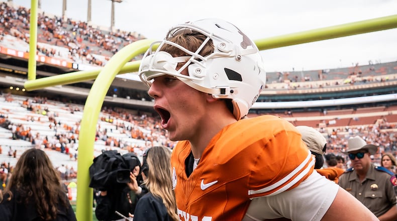 Texas Longhorns quarterback Arch Manning (16) celebrates the team's win over Vanderbilt during an NCAA college football game in Austin, Texas, Saturday, Nov. 1, 2025. (Sara Diggins/Austin American-Statesman via AP)