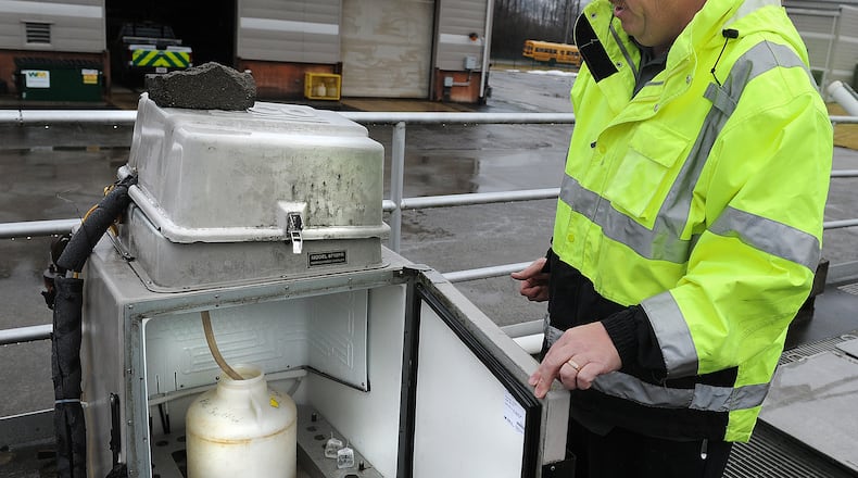 Operations manager Jim Boyd shows how wastewater is collected for COVID-19 testing at the Greene County wastewater treatment plant in Beavercreek.  MARSHALL GORBY\STAFF