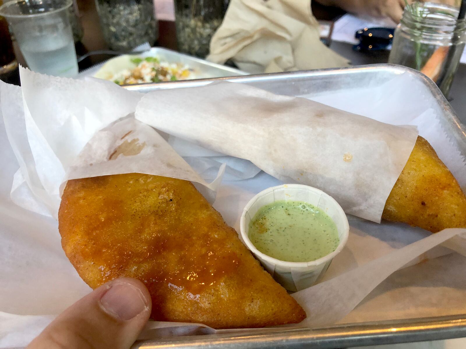 Latin Arepas is located with in Bar Granada on Monument Avenue on Dayton. Empanadas are pictured.
