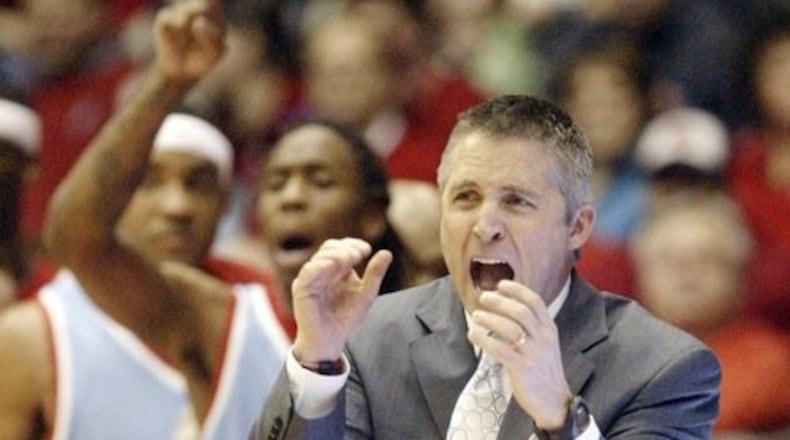 UD Head Coach Brian Gregory gets excited about his team's first-half play against UNC Greensboro on Saturday, Dec. 20 at UD Arena.