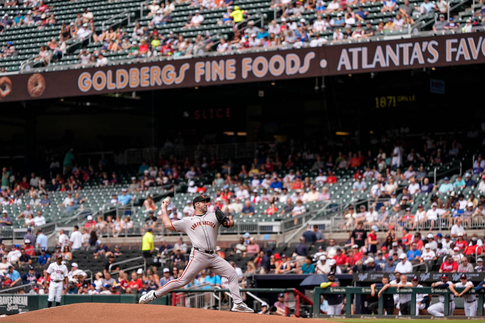 San Francisco Giants pitcher Justin Verlander (35) delivers in the first inning of a baseball game against the Atlanta Braves, Wednesday, July 23, 2025, in Atlanta. (AP Photo/Mike Stewart)