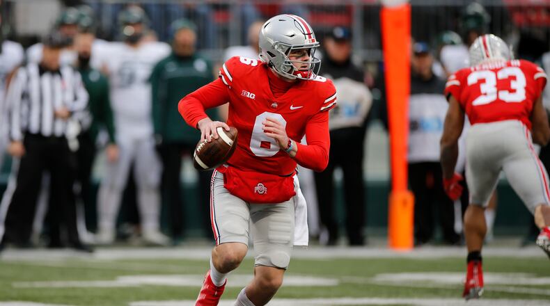 Ohio State quarterback Kyle McCord looks for an open receiver against Michigan State during the second half of an NCAA college football game Saturday, Nov. 20, 2021, in Columbus, Ohio. (AP Photo/Jay LaPrete)