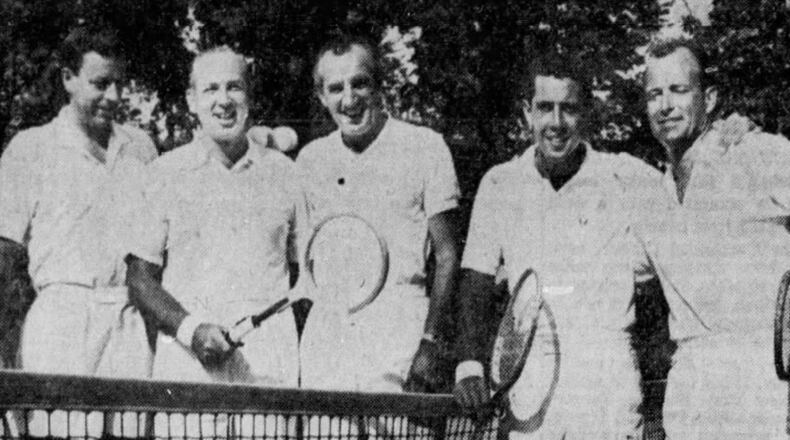Nick Bollettieri, second from right, poses for a photo at Urbana Country Club in August 1959 with (left to right): Urbana Country Club pro Fred Norcross; Jack March, the director of the World Tennis Championships in Cleveland; former world amateur champion Fred Perry; and, far right, California professional champion Bob Rodgers. Springfield News-Sun photo