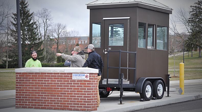 VA workers are setting up booths to screen visitors to and employees of the Dayton VA Medical Center campus, beginning Wednesday morning. All veterans, visitors and volunteers are asked to use the Gettysburg Avenue or South Liscum Drive entrances between 6:30 and 9:30 a.m. Monday to Friday. Staff are advised to use the North Liscum entrance. All three gates will be open to everyone from 9:30 a.m. until 8 p.m. Monday to Friday. MARSHALL GORBY/STAFF