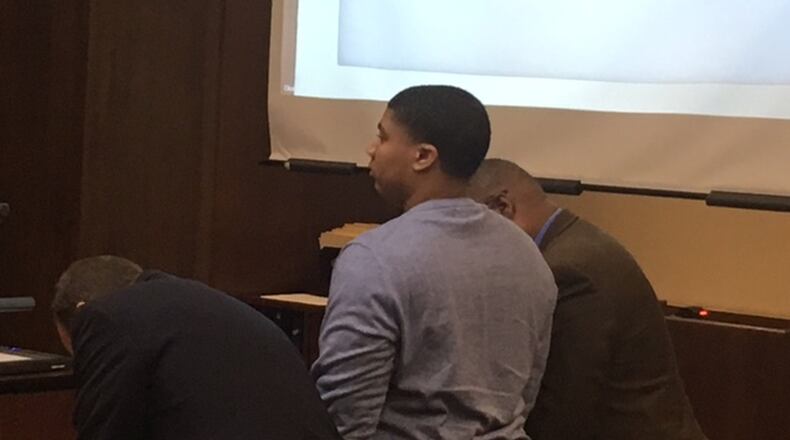 Kylen Gregory of Kettering is flanked by his attorneys Tuesday during the first day of testimony in his murder trial for the death of Ronnie Bowers. Bowers died after being shot in the back of the head on Sept. 4, 2016 in Kettering.