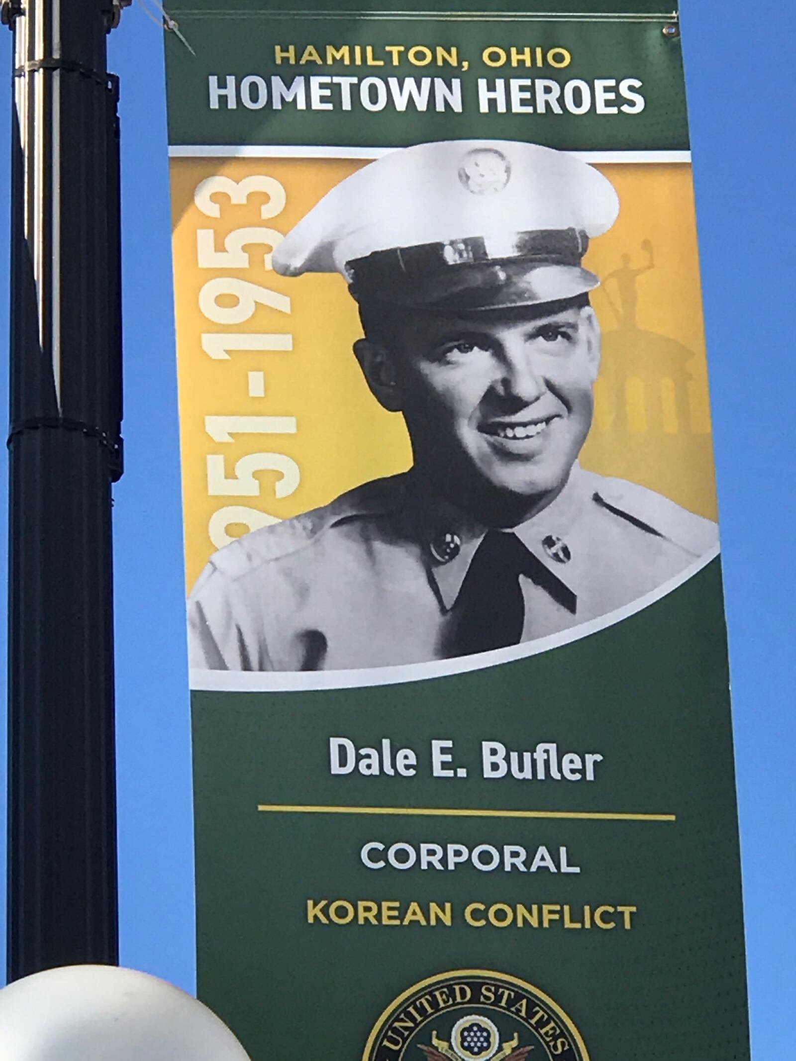 The Hometown Heroes banner honoring U.S. Army Corporal Dale Bufler that is mounted on a light pole along Main Street in Hamilton. Tom Archdeacon/CONTRIBUTED