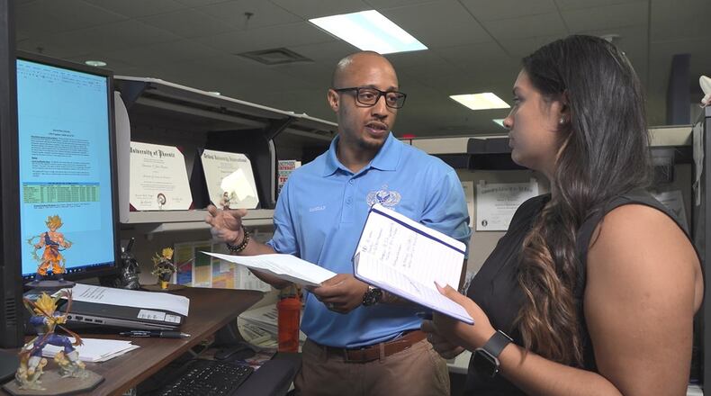Darian Jeri-Greene interacts with Tina Banerjee, a management analyst intern in the 88th Force Support Squadron Manpower and Organization Office, Wright-Patterson Air Force Base, July 2018. Programs such as the Air Force Premier College Intern Program are part of the myriad of personnel initiatives across the Air Force to help build the next generation civilian workforce. A two-year pilot program to test additional strategies to improve the Air Force civilian hiring process will begin Oct. 28. (U.S. Air Force photo)