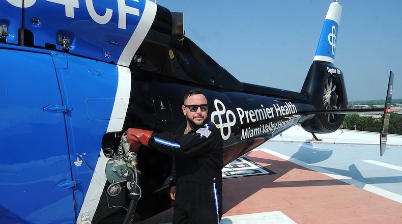 CareFlight pilot, Nick Henderson refuels on the north pad atop Miami Valley Hospital Wednesday, July 5, 2023. MARSHALL GORBY\STAFF