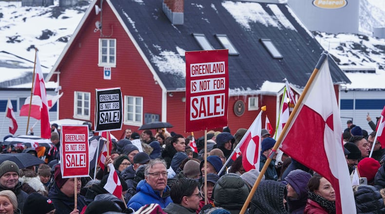 FILE - People protest against President Donald Trump's policy towards Greenland in front of U..S consulate in Nuuk, Greenland, Jan. 17, 2026. (AP Photo/Evgeniy Maloletka, File)
