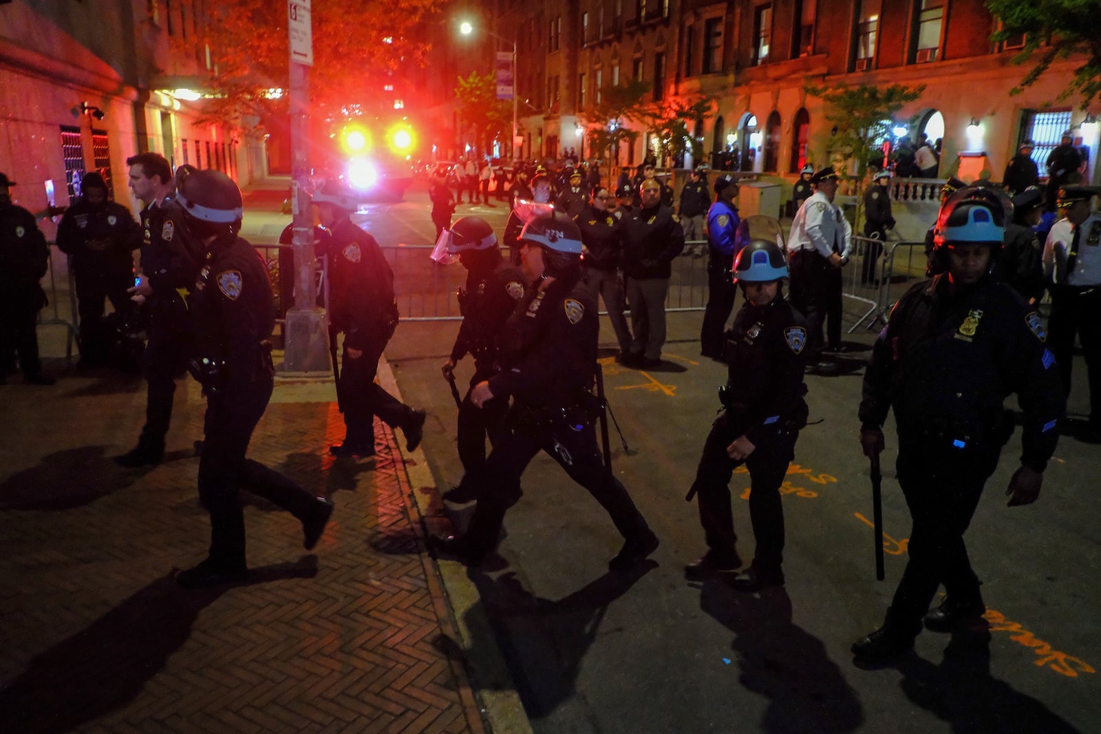 FILE - Members of the New York Police Department strategic response team move towards an entrance to Columbia University, Tuesday, April 30, 2024, in New York. (AP Photo/Julius Motal, File)