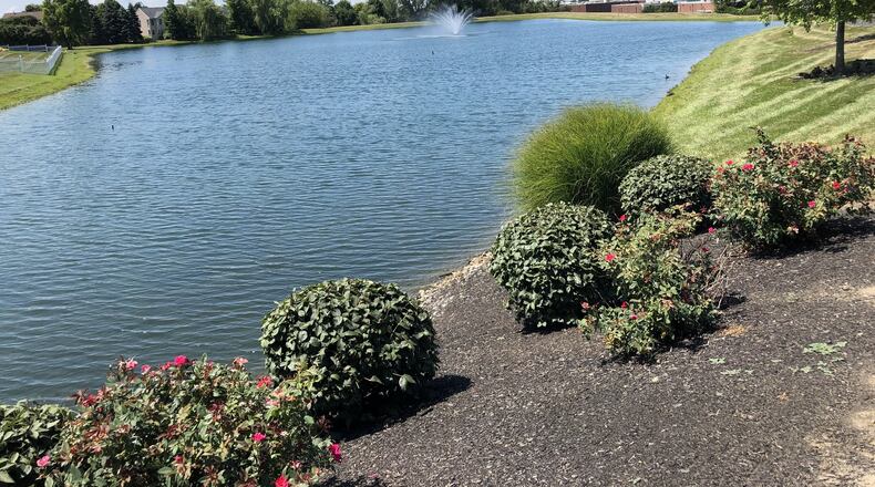 The Ohio Attorney General’s Office has sued the Settlers Walk Homeowners Association and MCS Land Development over the condition of the dam holding this body of water off Remick Road in Springboro. STAFF/LAWRENCE BUDD