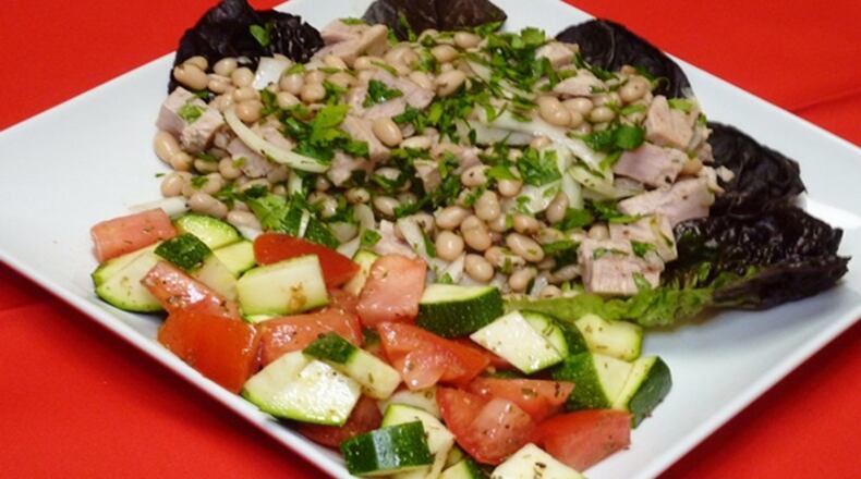 This Tuscan Bean and Tuna Salad uses fresh tuna. Red onion lends texture and flavor to the salad. (Linda Gassenheimer/TNS)