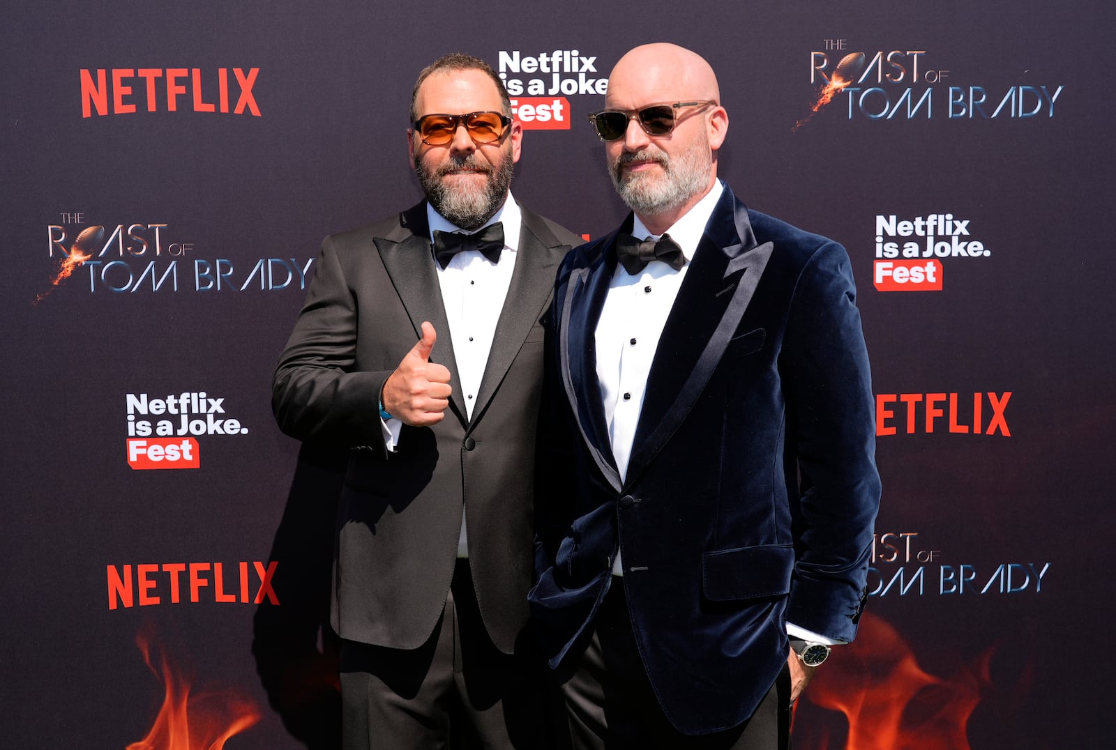 Comedians Bert Kreischer, left, and Tom Segura pose together at "The Greatest Roast of All Time: Tom Brady" at the Kia Forum, Sunday, May 5, 2024, in Inglewood, Calif. Segura will perform Sept. 5 at the Schuster Center. (AP Photo/Chris Pizzello)