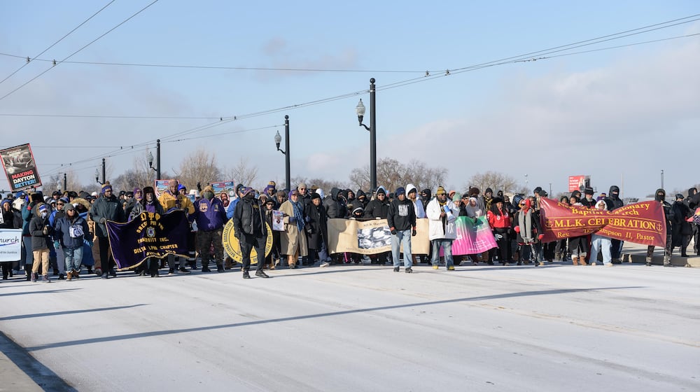 Daytonians gathered to honor Rev. Dr. Martin Luther King Jr. at the annual MLK Day Memorial March on Monday, Jan. 19, 2026. The march started at the Drew Health Center on W. Third St. through the Wright Dunbar Business District over the Dayton Peace Bridge and concluded at Sinclair Community College. TOM GILLIAM / CONTRIBUTING PHOTOGRAPHER