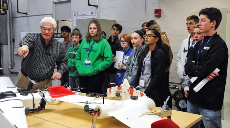 Rick Patton, Autonomous Navigation Technology Center engineer, describes different types of remotely piloted aircraft to local students during the Air Force Institute of Technology’s “Demo Days” April 2. (U.S. Air Force photo/Airman 1st Class Emily Woodring)