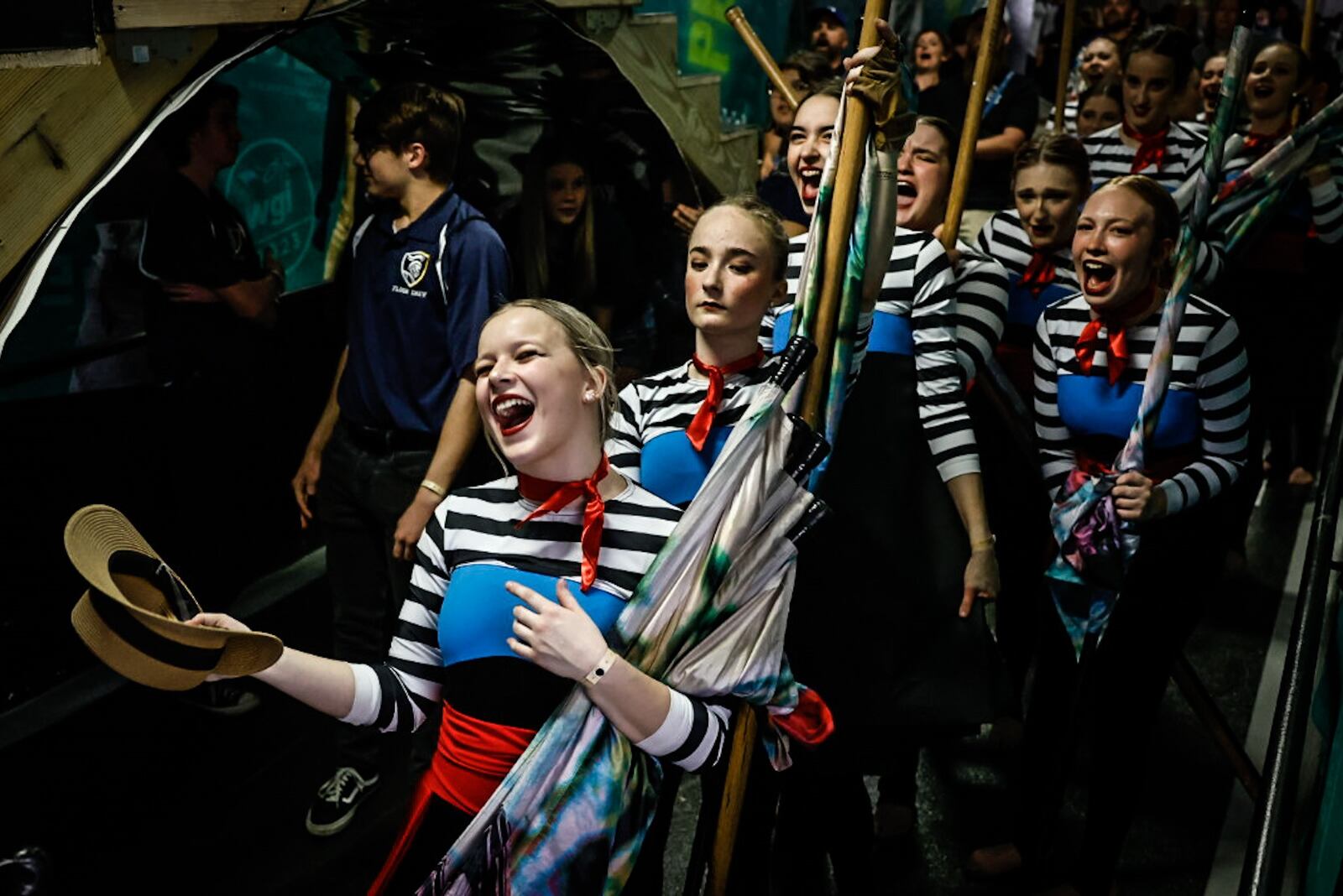 Miamisburg High School color guard team member, Kaiya McCurray screams for her teammates to get ready to perform at the WGI Color Guard World Championships round 2 at UD Arena Thursday April 13, 2023. JIM NOELKER/STAFF