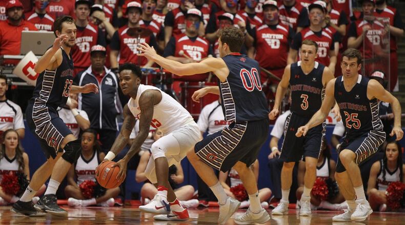 Dayton’s John Crosby looks to make a pass against Saint Mary’s on Saturday, Nov. 19, 2016, at UD Arena. David Jablonski/Staff