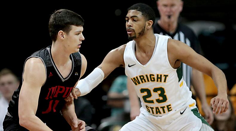 Wright State University forward James Manns covers IUPUI forward/center Brandon Kenyon during their Horizon League game at the Nutter Center in Fairborn Sunday, Feb. 16, 2020. Wright State won 106-66. Contributed photo by E.L. Hubbard
