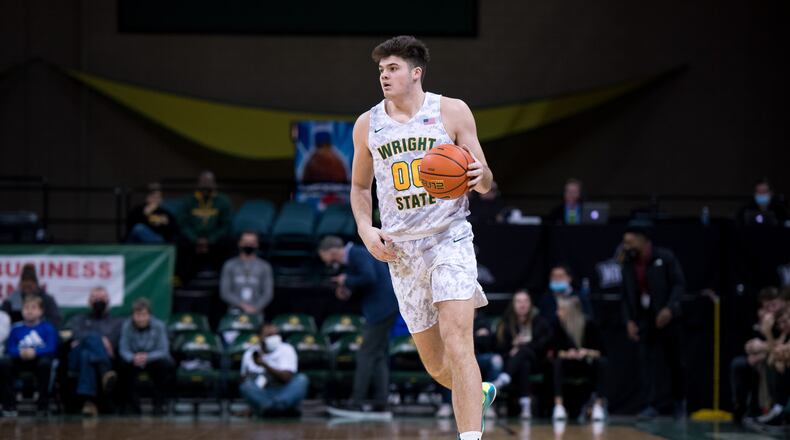 Wright State's Grant Basile brings the ball up court during a game vs. Oakland at the Nutter Center on Saturday, Feb. 5, 2022. Joseph Craven/Wright State Athletics