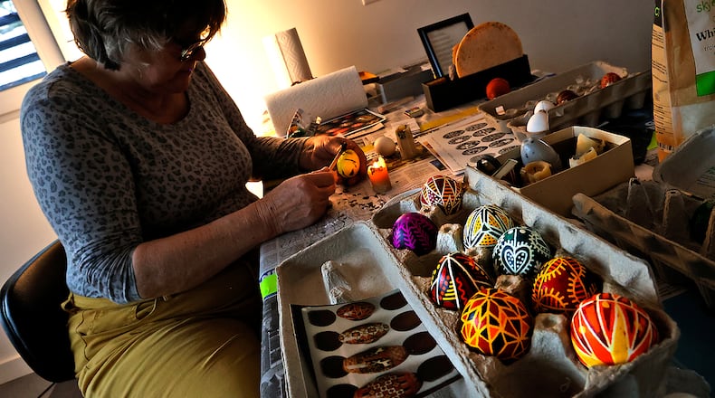 Vaka Pereyma decorates her Ukrainian Pysanky egg during a workshop Saturday, March 18, 2023 at Frank Lloyd Wright's Westcott House in Springfield. The workshop, taught by artist Christina Pereyma, teaches the ancient form of folk art that originated in Ukraine in pre-Christian times. It involves melting wax and applying it an egg in intricate patterns then dying the eggs in stages to get the desired design. All the proceeds from the registration fee for the workshop will go toward the Ukraine Heritage Response Fund.  BILL LACKEY/STAFF