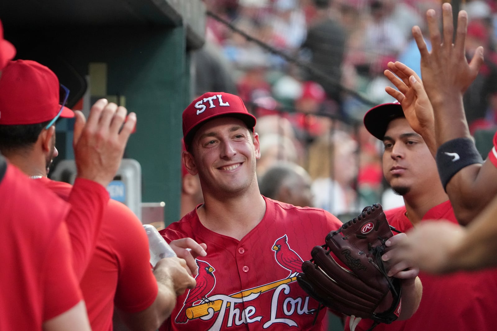 St. Louis Cardinals starting pitcher Andre Pallante smiles in the dugout after being removed during the seventh inning of a baseball game against the Cincinnati Reds Friday, June 20, 2025, in St. Louis. (AP Photo/Jeff Roberson)